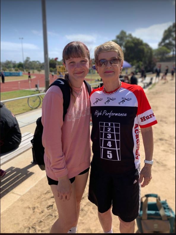Coach Maureen congratulates Jess after her PB performance in the 200 metres
