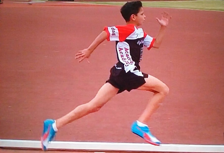 Little Athlete Sprinting with an advanced sprinting technique.